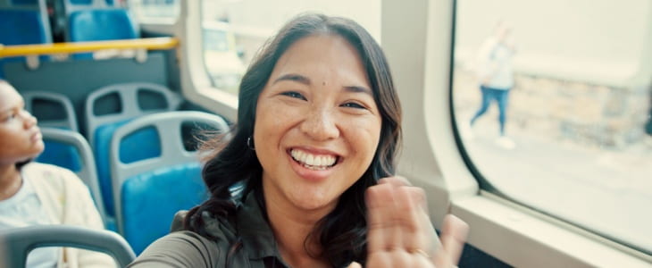 Smiling woman on charter bus